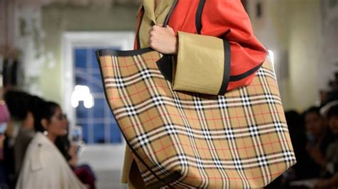 burberry uk sales drop as wealthy tourists shop elsewhere|burberry stock news.